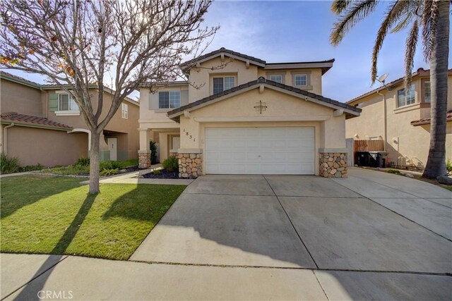 traditional-style home featuring stucco siding, a front yard, stone siding, and concrete driveway