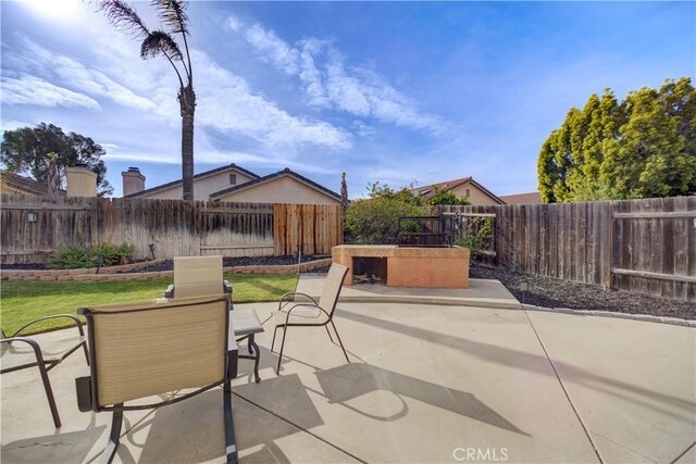 view of patio with a fenced backyard and outdoor dining space
