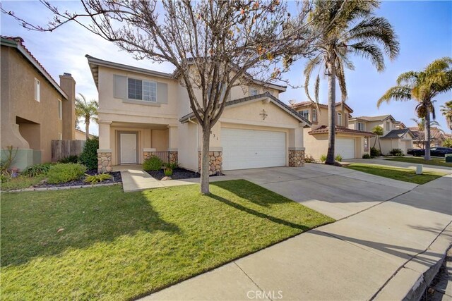 traditional-style home featuring stucco siding, concrete driveway, a front lawn, and stone siding