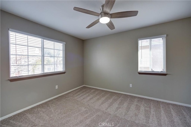 carpeted empty room with ceiling fan