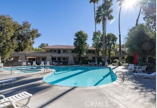 view of swimming pool with a patio