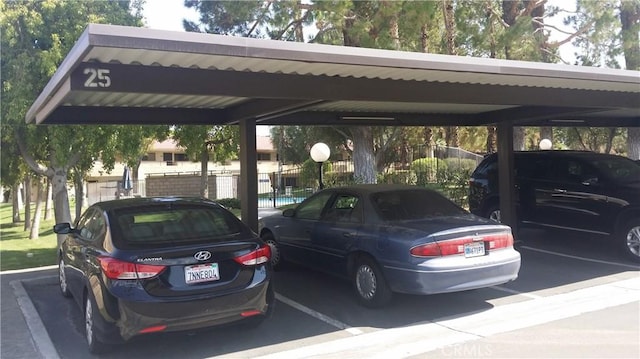 view of vehicle parking featuring a carport