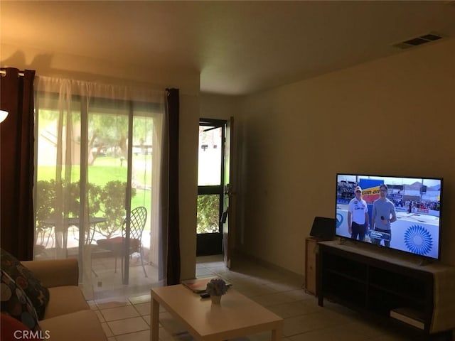 675 N Los Felices Cir W Unit J107, Palm Springs, CA 92262 - living room featuring light tile patterned floors