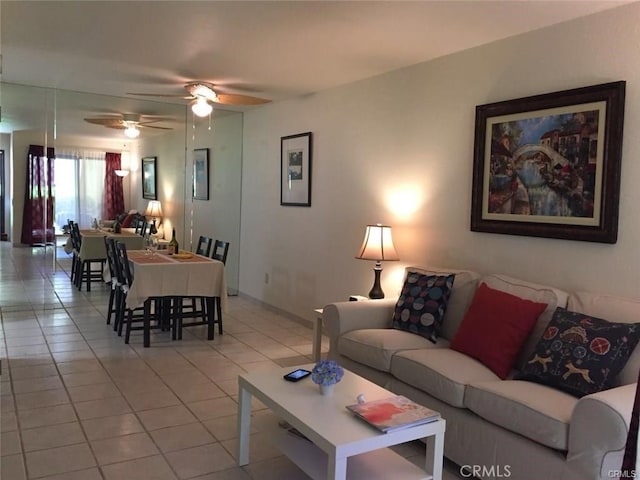 living room with light tile patterned floors and ceiling fan