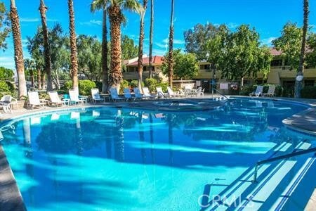 675 N Los Felices Cir W Unit J107, Palm Springs, CA 92262 - community pool with a patio area