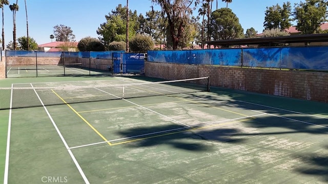 675 N Los Felices Cir W Unit J107, Palm Springs, CA 92262 - view of tennis court featuring community basketball court