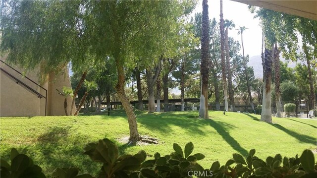 675 N Los Felices Cir W Unit J107, Palm Springs, CA 92262 - view of green lawn
