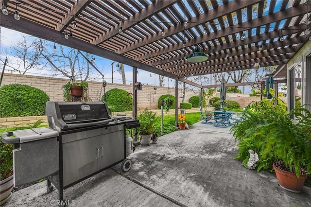 view of patio featuring grilling area and a pergola