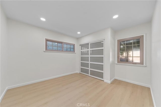 spare room with light wood-type flooring