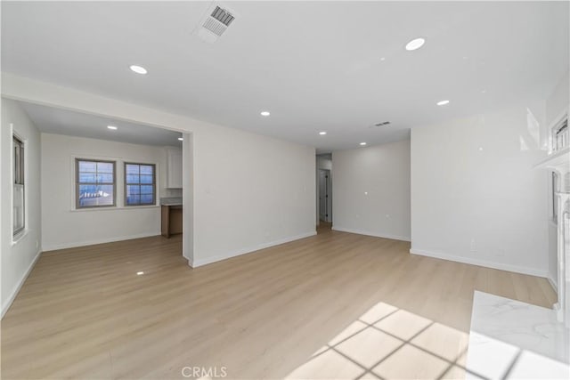 unfurnished living room with light hardwood / wood-style floors