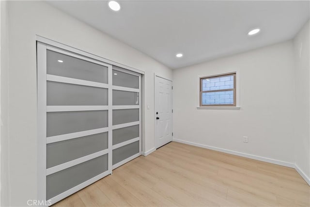 empty room with light wood-type flooring