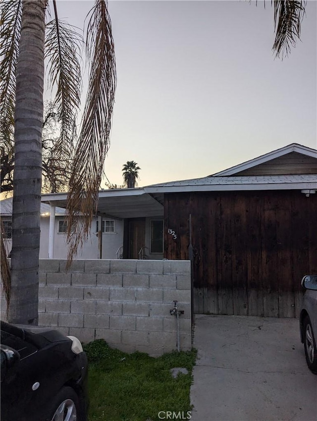 view of property exterior at dusk