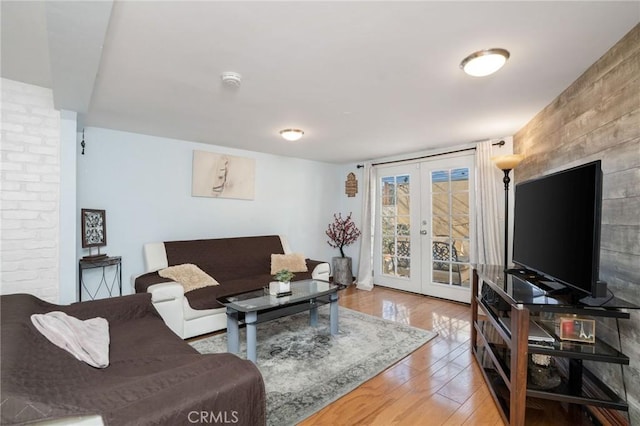 living room with french doors and hardwood / wood-style floors