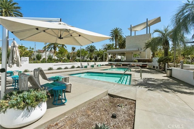 view of swimming pool featuring a patio area