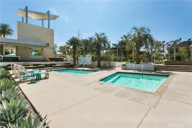 view of pool with a community hot tub and a patio