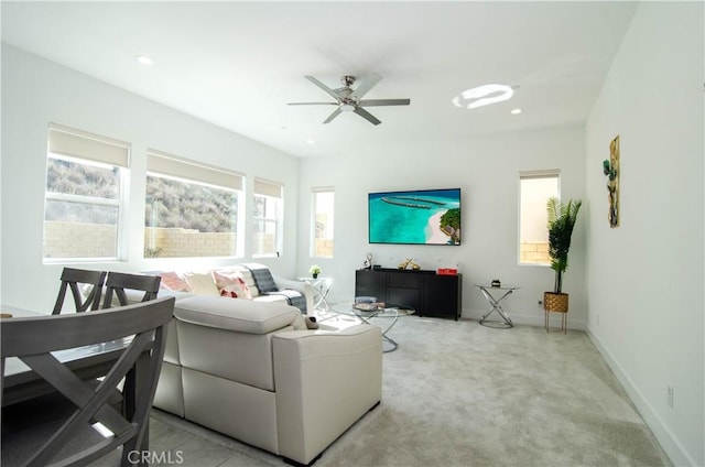 living area featuring recessed lighting, carpet flooring, ceiling fan, and baseboards