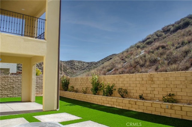 exterior space with a fenced backyard and a mountain view