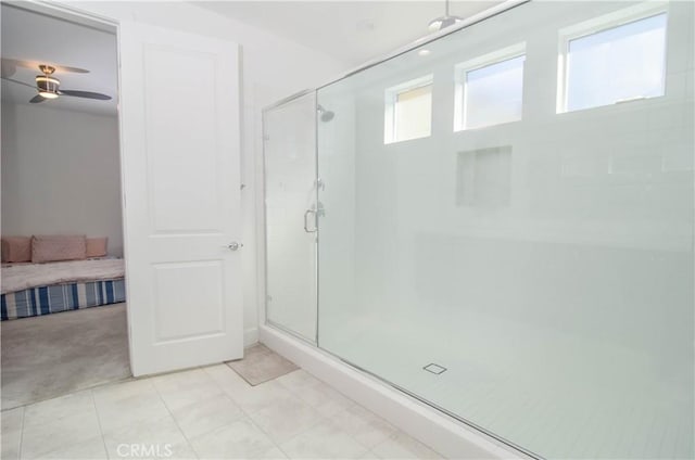 full bathroom featuring a stall shower, ensuite bath, and ceiling fan