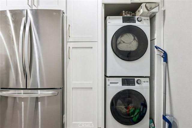 laundry room featuring stacked washer and dryer