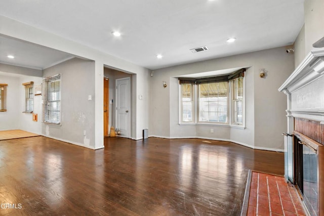 unfurnished living room featuring dark hardwood / wood-style floors