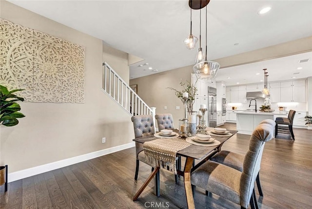 dining room featuring dark hardwood / wood-style floors and sink