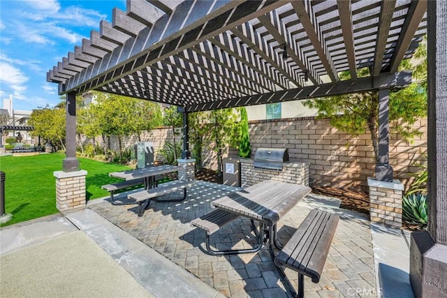 view of patio / terrace featuring an outdoor kitchen, a grill, and a pergola