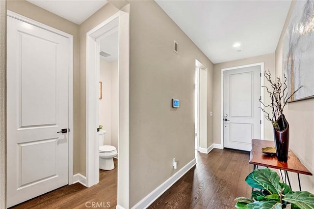 entryway with dark wood-type flooring