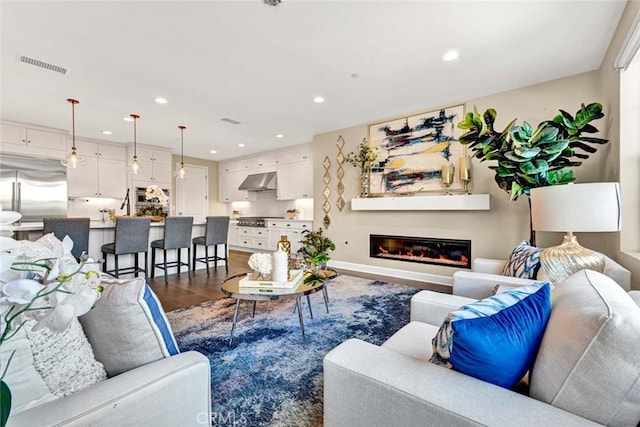 living room with dark hardwood / wood-style floors