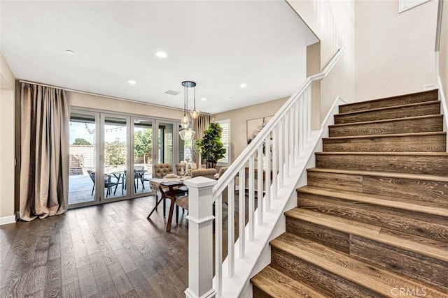 stairway featuring hardwood / wood-style flooring and french doors