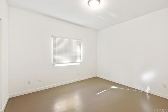 empty room featuring concrete flooring