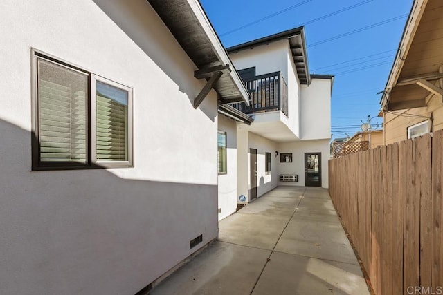 view of side of property with a patio