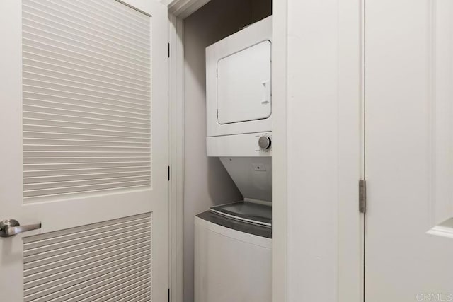 washroom with stacked washer / dryer
