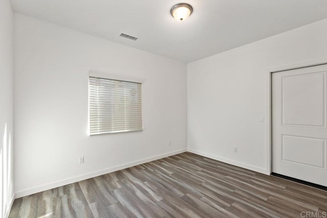 unfurnished room featuring wood-type flooring