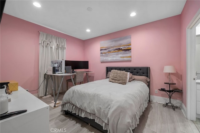 bedroom with light hardwood / wood-style floors