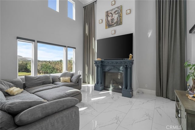 living room featuring a high ceiling