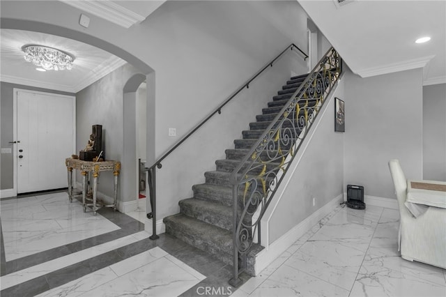 foyer featuring crown molding