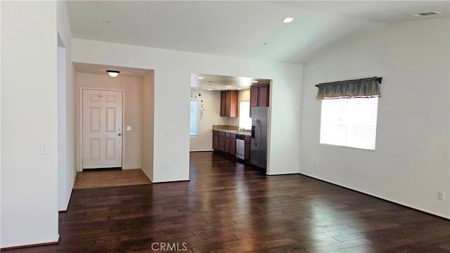 unfurnished living room with dark wood-type flooring, lofted ceiling, visible vents, and recessed lighting