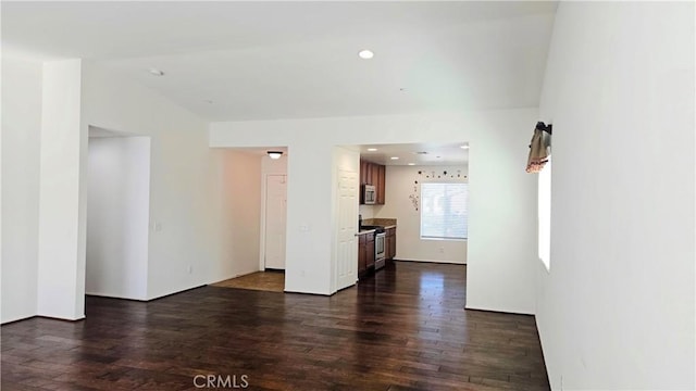 unfurnished room with recessed lighting and dark wood finished floors