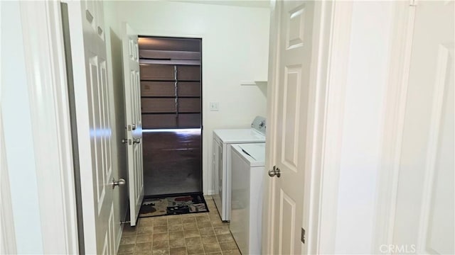 washroom with laundry area and washer and dryer