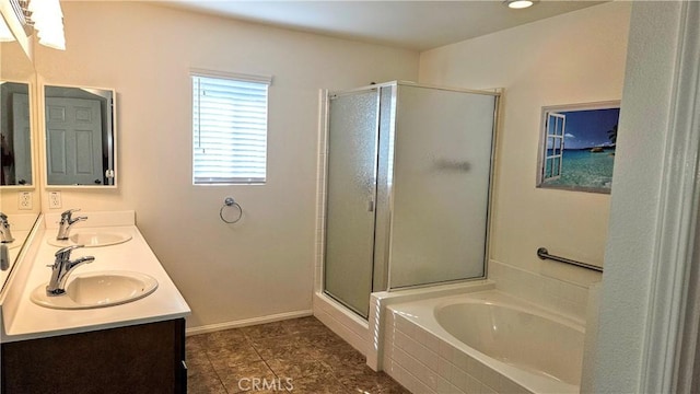 bathroom with a garden tub, double vanity, a sink, and a shower stall