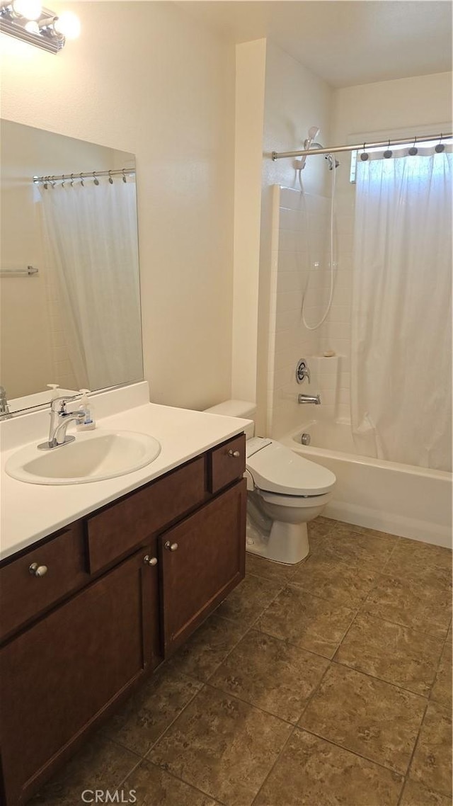 bathroom with shower / tub combo, vanity, and toilet