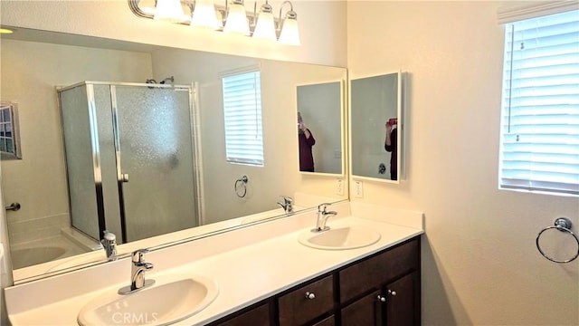 full bath featuring a stall shower, a garden tub, a sink, and double vanity