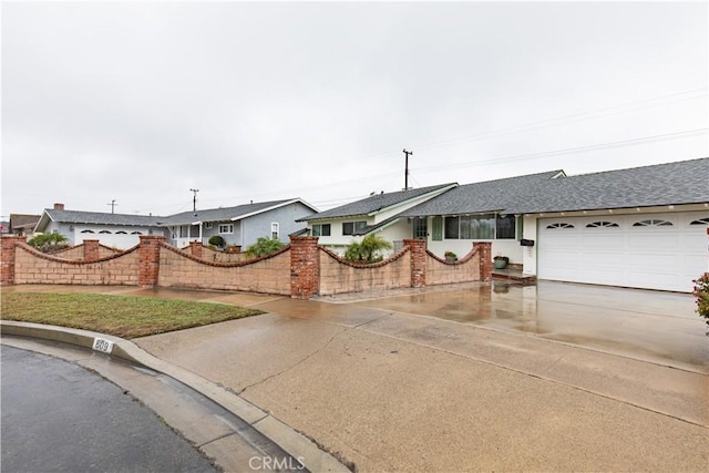 single story home featuring a garage