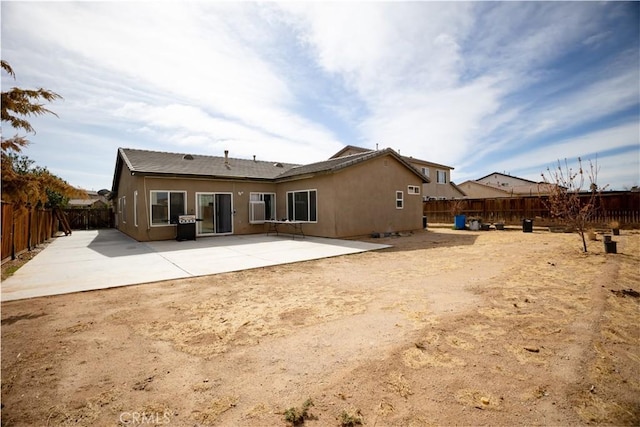 back of house with a patio