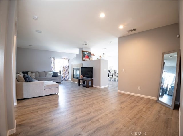 living room with light hardwood / wood-style floors