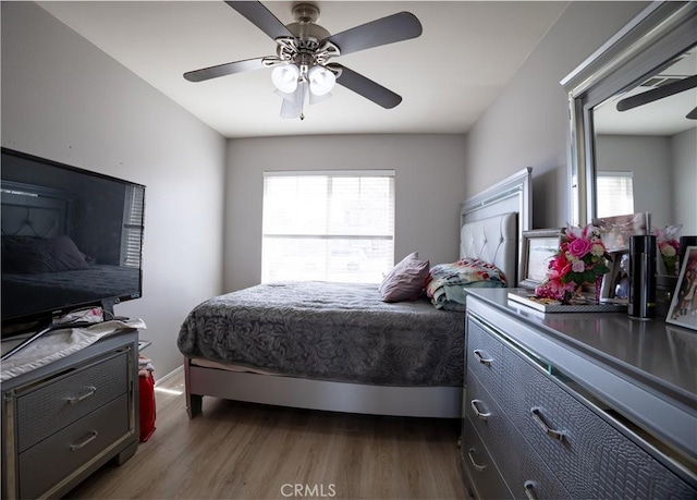 bedroom featuring ceiling fan and dark hardwood / wood-style flooring