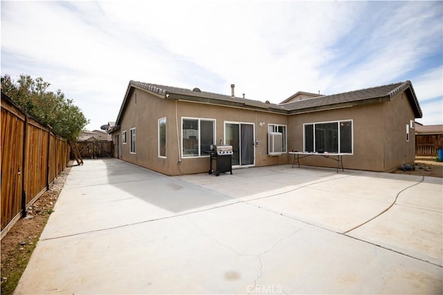 back of property featuring a patio