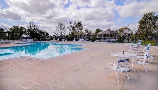 view of swimming pool with a gazebo and a patio