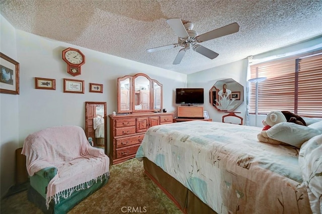 carpeted bedroom with ceiling fan and a textured ceiling