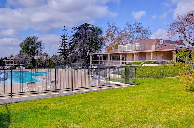 view of swimming pool featuring a patio area and a lawn